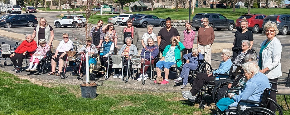 CrestRidge folks plant a crab tree for Earth Day 2026